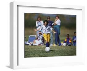 8 Year Old Girl in Action Durring Soccer Game, Lakewood, Colorado, USA-null-Framed Photographic Print