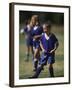 8 Year Old Girl in Action Durring Soccer Game, Lakewood, Colorado, USA-null-Framed Photographic Print