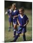 8 Year Old Girl in Action Durring Soccer Game, Lakewood, Colorado, USA-null-Mounted Photographic Print