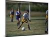 8 Year Old Girl in Action Durring Soccer Game, Lakewood, Colorado, USA-null-Mounted Photographic Print