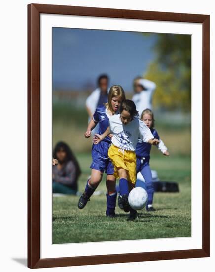 8 Year Old Girls in Action Durring Soccer Game, Lakewood, Colorado, USA-null-Framed Photographic Print