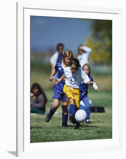 8 Year Old Girls in Action Durring Soccer Game, Lakewood, Colorado, USA-null-Framed Photographic Print