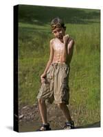 9 Year Old Boy Posing on a Rock Next to a Pond, Woodstock, New York, USA-Paul Sutton-Stretched Canvas