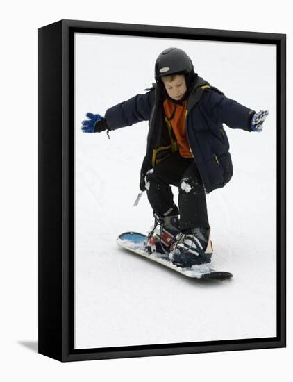9 Year Old Boy Riding His Snowboard, New York, USA-Paul Sutton-Framed Stretched Canvas