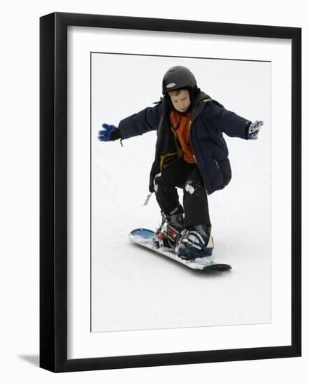 9 Year Old Boy Riding His Snowboard, New York, USA-Paul Sutton-Framed Photographic Print