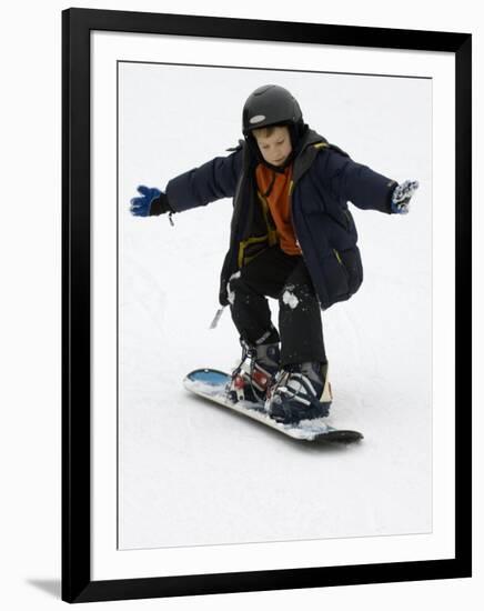 9 Year Old Boy Riding His Snowboard, New York, USA-Paul Sutton-Framed Photographic Print