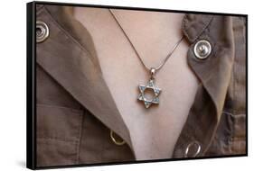 A 10-year-old girl wearing Star of David jewelry, Hertzliya-Godong-Framed Stretched Canvas