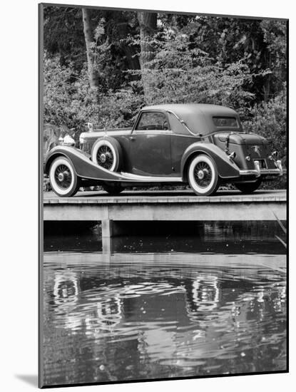 A 1933 Hispano-Suiza K6 Reflected in a Lake-null-Mounted Photographic Print