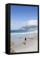 A 20-25 Year Old Young Brazilian Woman on Ipanema Beach with the Morro Dois Irmaos Hills-Alex Robinson-Framed Stretched Canvas