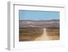 A 4X4 Car Leaves a Cloud of Dust as it Apporachs Along the Long Dusty Road to the Fish River Canyon-Alex Treadway-Framed Photographic Print