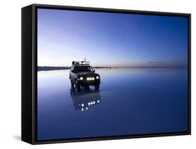 A 4X4 Rests in the Early Am Reflection in a Flooded Salt Flat In-Sergio Ballivian-Framed Stretched Canvas