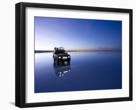 A 4X4 Rests in the Early Am Reflection in a Flooded Salt Flat In-Sergio Ballivian-Framed Photographic Print