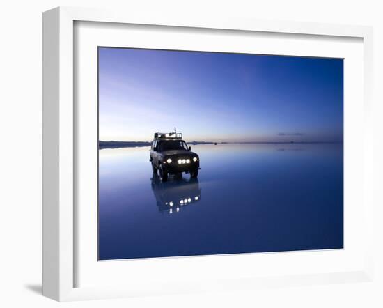 A 4X4 Rests in the Early Am Reflection in a Flooded Salt Flat In-Sergio Ballivian-Framed Photographic Print