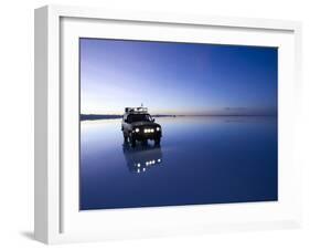 A 4X4 Rests in the Early Am Reflection in a Flooded Salt Flat In-Sergio Ballivian-Framed Photographic Print