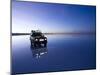 A 4X4 Rests in the Early Am Reflection in a Flooded Salt Flat In-Sergio Ballivian-Mounted Photographic Print