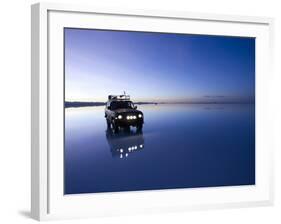 A 4X4 Rests in the Early Am Reflection in a Flooded Salt Flat In-Sergio Ballivian-Framed Photographic Print
