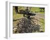 A .50 Caliber Browning Machine Gun with a Pile of Spent Cases and Links-Stocktrek Images-Framed Photographic Print