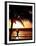 A Afternoon Runner Passes Under a Palm Tree as the Sun Sets Behind-null-Framed Premium Photographic Print