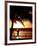 A Afternoon Runner Passes Under a Palm Tree as the Sun Sets Behind-null-Framed Photographic Print