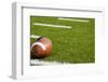A American Football on a Green Football Field-flippo-Framed Photographic Print