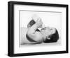 A Baby Lies on His Back Drinking Milk from His Bottle-null-Framed Photographic Print