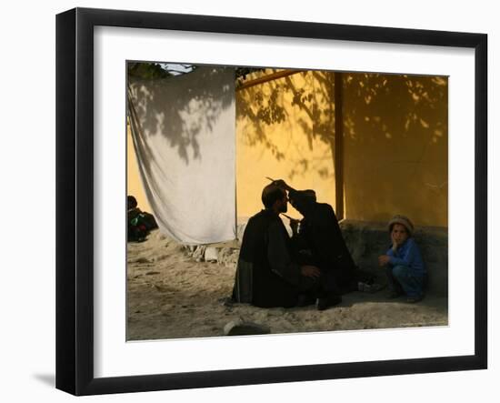 A Barber Cuts the Beard of a Client in His Barber Post in Kabul, Afghanistan, October 1, 2006-Rodrigo Abd-Framed Photographic Print