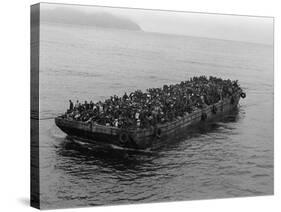 A Barge Packed with Vietnamese Refugees from Danang is Towed to the Ss Pioneer Contender-null-Stretched Canvas
