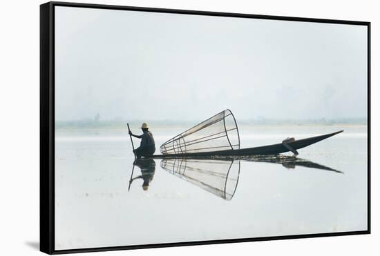 A basket fisherman on Inle Lake scans the still and shallow water for signs of life, Myanmar (Burma-Alex Treadway-Framed Stretched Canvas