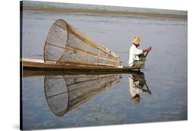 A basket fisherman on Inle Lake scans the still and shallow water for signs of life, Shan State, My-Alex Treadway-Stretched Canvas