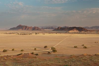 https://imgc.allpostersimages.com/img/posters/a-beautiful-landscape-in-namib-naukluft-national-park-taken-from-the-top-of-elim-dune_u-L-PU6U260.jpg?artPerspective=n
