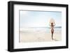 A Beautiful Surfer Girl at the Beach Holding up Her Surfboard-iko-Framed Photographic Print