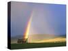 A Beaverslide Haystacker with Full Rainbow in the Big Hole Valley, Jackson, Montana, USA-Chuck Haney-Stretched Canvas