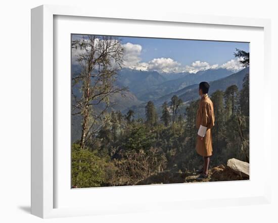 A Bhutanese Man in National Costume Views an Eastern Himalayan Mountain Range from the 11,000-Foot--Nigel Pavitt-Framed Photographic Print