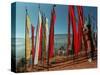 A Bhutanese Man Straightens a Prayer Flag at a Buddhist Shrine-null-Stretched Canvas