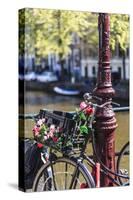 A Bicycle Decorated with Flowers by a Canal, Amsterdam, Netherlands, Europe-Amanda Hall-Stretched Canvas