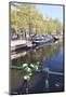 A Bicycle Decorated with Flowers by a Canal, Amsterdam, Netherlands, Europe-Amanda Hall-Mounted Photographic Print