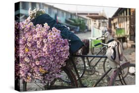 A bike loaded with fresh flowers at the flower market in Mandalay, Myanmar (Burma), Asia-Alex Treadway-Stretched Canvas