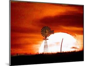 A Blazing Sun Drops Behind a Windmill-null-Mounted Photographic Print