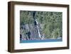 A boat in front of a waterfall on Puelo Lake in the Tagua Tagua reserve, Patagonia, Chile, South Am-Alex Robinson-Framed Photographic Print