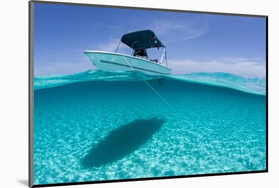 A Boat Is Anchored in the Clear Blue Tropical Waters Off Staniel Cay, Exuma, Bahamas-James White-Mounted Photographic Print