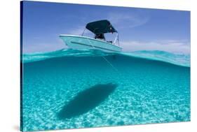 A Boat Is Anchored in the Clear Blue Tropical Waters Off Staniel Cay, Exuma, Bahamas-James White-Stretched Canvas