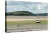 A Boat Moored at Low Tide in the River Camel Estuary at Padstow Cornwall UK-Julian Eales-Stretched Canvas