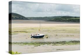 A Boat Moored at Low Tide in the River Camel Estuary at Padstow Cornwall UK-Julian Eales-Stretched Canvas