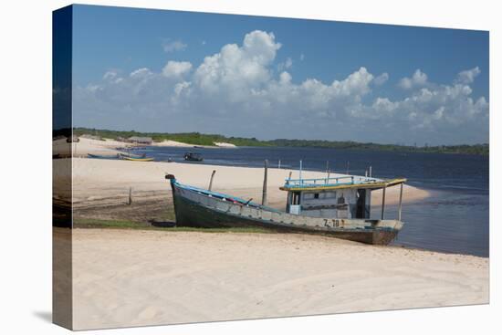 A Boat Sits on Rio Preguicas River Bank Near Lencois Maranhenses National Park-Alex Saberi-Stretched Canvas