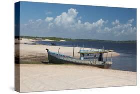 A Boat Sits on Rio Preguicas River Bank Near Lencois Maranhenses National Park-Alex Saberi-Stretched Canvas