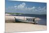 A Boat Sits on Rio Preguicas River Bank Near Lencois Maranhenses National Park-Alex Saberi-Mounted Photographic Print