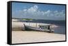 A Boat Sits on Rio Preguicas River Bank Near Lencois Maranhenses National Park-Alex Saberi-Framed Stretched Canvas