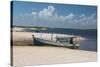 A Boat Sits on Rio Preguicas River Bank Near Lencois Maranhenses National Park-Alex Saberi-Stretched Canvas