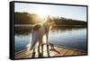 A Border Collie Looks Out over a Lake During an Autumn Sunrise in Eastern Pennsylvania-Vince M. Camiolo-Framed Stretched Canvas