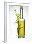 A Bottle of Rapeseed Oil with Flowers-Bodo A^ Schieren-Framed Photographic Print